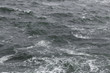 Rough choppy ocean surface murky blue
