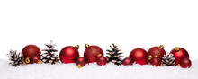 Red Christmas Balls And Pine Cones Isolated On Snow