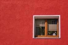 Wooden Frame Window Of A Red Wall House 