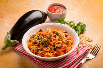 Canvas Print - tagliatelle with eggplant omato sauce and pinenuts