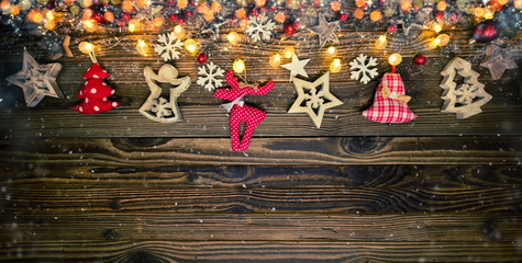 Wall Mural - Christmas background with wooden and cloth decorations and spot lights.