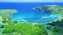 Aerial: Hanauma Bay Nature Preserve, Blue-Green Water Hawaiian Ocean Cove.  Tourist Location For Snorkeling On Coral Reef With Tropical Fish In Oahu Island, Hawaii.  Watersport For Ocean Adventurers