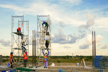 Wall Mural - construction worker on scaffolding in industrial construction