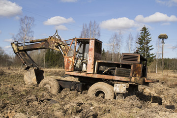 The image of the tractor stuck in the mud