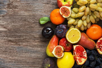  Collection of fruits on a wooden background top view