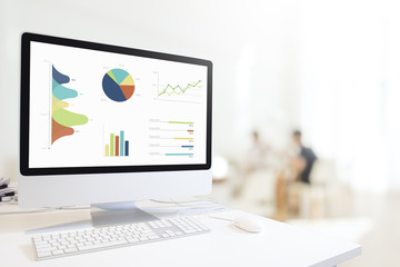 Poster - Modern computer with keyboard and mouse on white table showing charts and graph on screen against blurred people sitting in cafe background , Analysis Business, Statistics Concept.