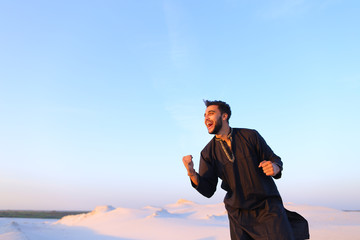 Happy portrait of male Arab, who smiles and rejoices in life, st