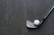 golf ball and golf club on black background