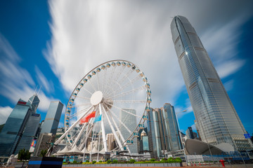 Fototapete - Observation Wheel in Hong Kong City skyline at sunrise. View from across central district Hongkong.
