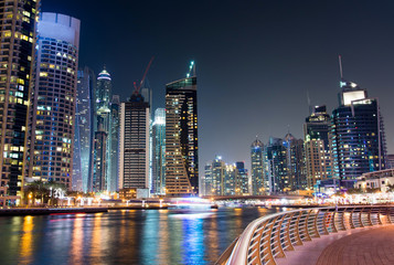 Wall Mural - Dubai marina with skyscrapers and calm water night view