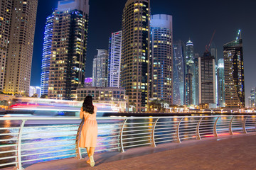 Girl enjoying Dubai marina view at night
