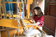 Asian Beautiful Young Woman Weaving Traditional Thai Fabric