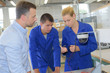 © auremar - students looking at cables of electric device