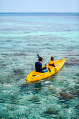 Poster - Family kayaking at tropical ocean