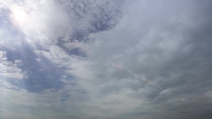 Poster - dramatic sun rays and clouds as background