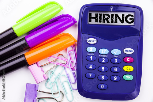 Fotografía Hiring text in the office with surroundings such as marker, pen writing on calculator