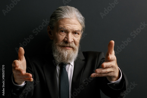 Stylish Grey Haired Man Showing Hands Old Male On Black