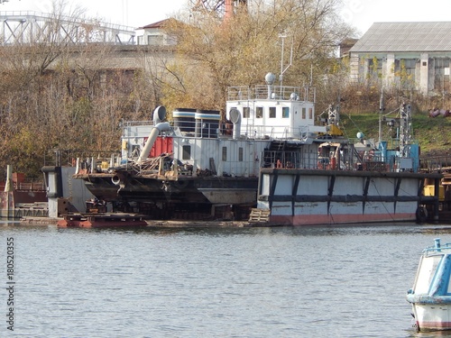 Fotografia, Obraz Dredging the vessel is in the floating dock for repairs. Photo.