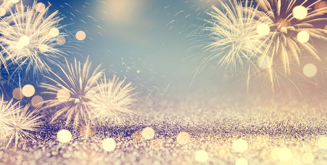 Wall Mural - gold and blue vintage fireworks and bokeh in new year eve and copy space. abstract background holida