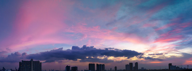 Wall Mural - Panorama of twilight sky and cloud at sunset over the city