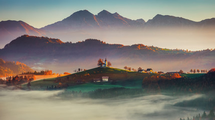 Wall Mural - panoramic sunrise view of saint tomas church, slovenia. autumn landscape.