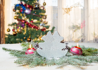 Wall Mural - christmas table background with christmas tree out of focus