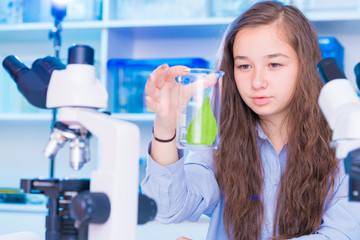 Poster - Girl in biology class with leaf  green plants