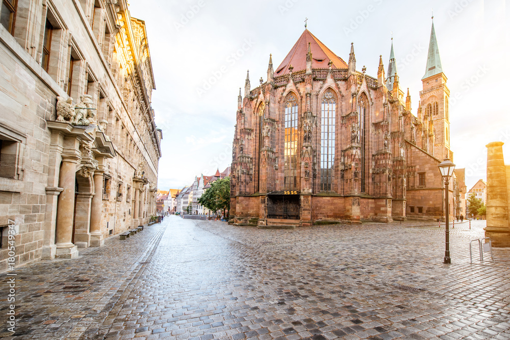 Street view on the saint Sebaldus cathedral during the sunset in Nurnberg city, Germany - obrazy, fototapety, plakaty 