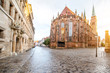 Street view on the saint Sebaldus cathedral during the sunset in Nurnberg city, Germany