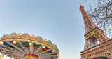 Fototapeta Boho - The Eiffel Tower and Merry-Go-Round wheel at sunset, Paris - France