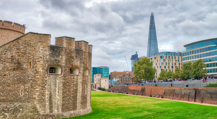 Wall Mural - The Tower of London and modern skyline on background, UK