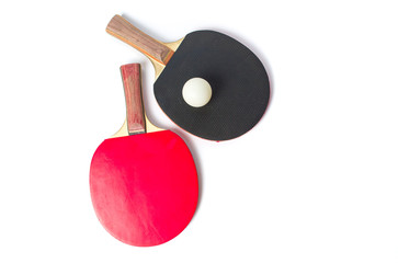 Two table tennis rackets and a ball isolated