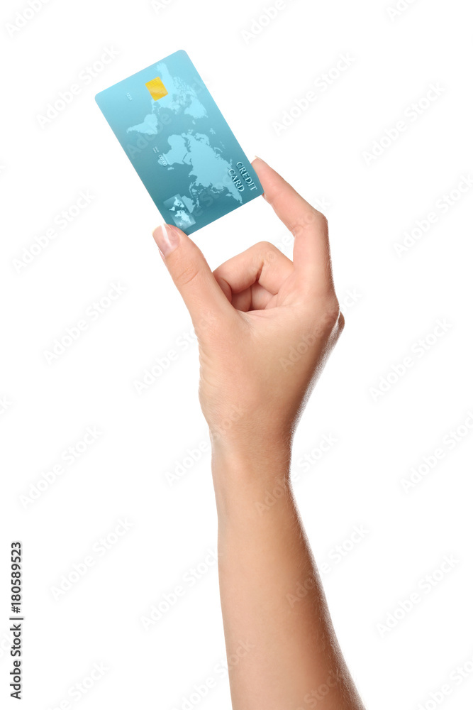 Woman's hand holding credit card on white background