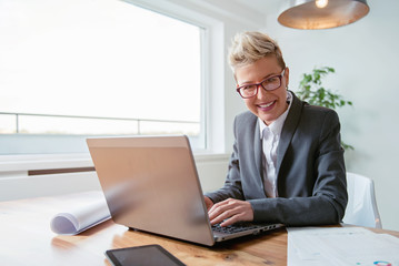 Wall Mural - Businesswoman working on a laptop 