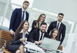 © yurolaitsalbert - concept of teamwork - a successful business team in the workplace in the office