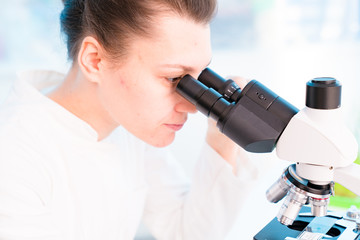 Young female technician in the laboratory of food quality control