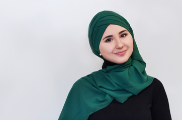 portrait of a happy girl in  green hijab. .