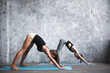 © BestForYou - Two young beautiful women doing yoga asana.