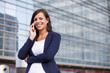 © BGStock72 - Portrait of young businesswoman in front of office building