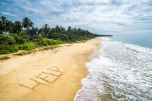 Uninhabited Tropical Island With Word Help In Deserted Beach, Sos And Shipwreck Concept