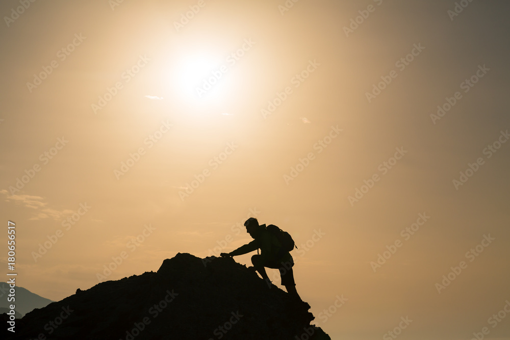 Climbing hiking silhouette in mountains over summer sunrise - obrazy, fototapety, plakaty 