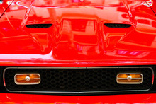 Close-up Of Hood And Grill Of Red Vintage Car