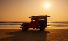 Surf Rescue Vehicle On Beach At Sunset