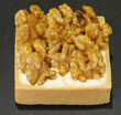 small cake with walnuts in the konditorei with background of bla