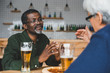 © LIGHTFIELD STUDIOS - senior friends having discussion at bar