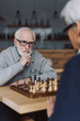 © LIGHTFIELD STUDIOS - senior men playing chess