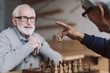 © LIGHTFIELD STUDIOS - senior men playing chess
