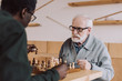 © LIGHTFIELD STUDIOS - senior men playing chess
