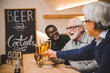 © LIGHTFIELD STUDIOS - senior friends drinking beer together