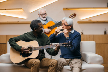 senior friends playing music